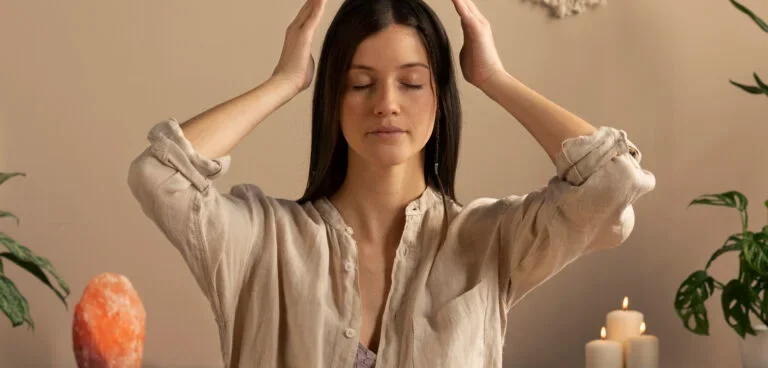 Therapist guiding meditation or self-care routine in a peaceful room.